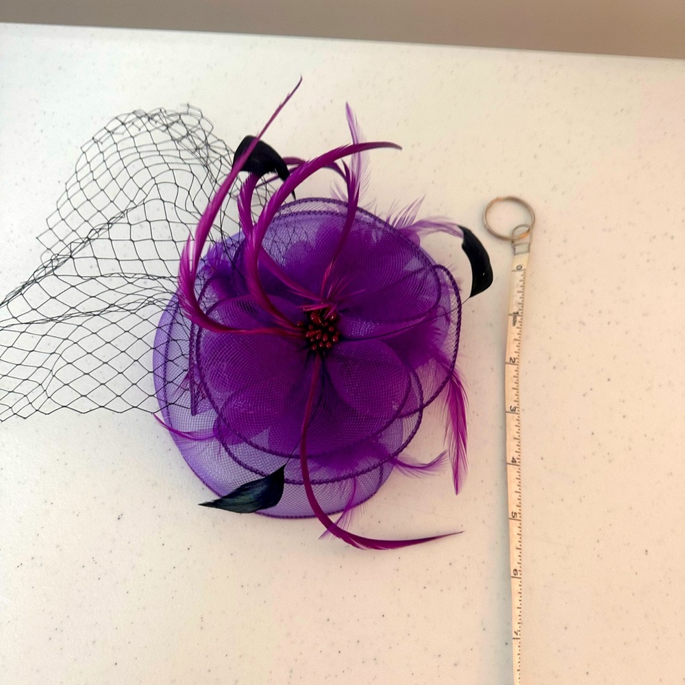 Hair accessory fascinator.  Purple, black feathers, netting. Clipped to hair.